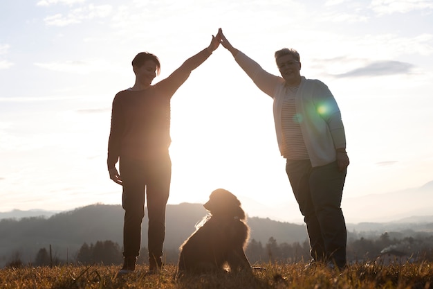 Full shot family silhouette in nature