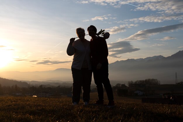 Full shot family silhouette in nature