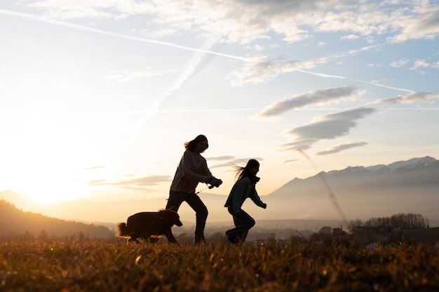 Full shot family silhouette in nature