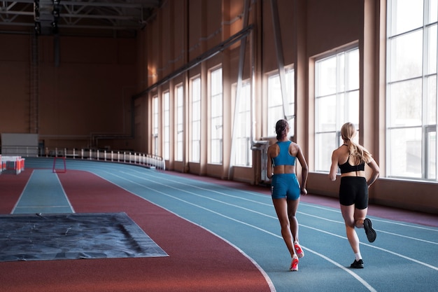 Full shot fit women running together