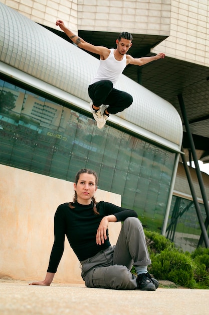 Full shot friends doing parkour