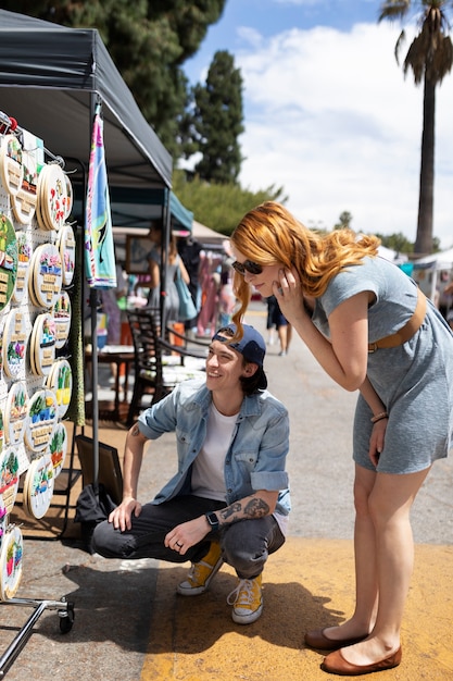 Full shot friends at flea market