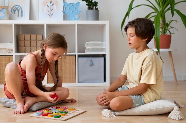 Full shot friends making puzzle on floor