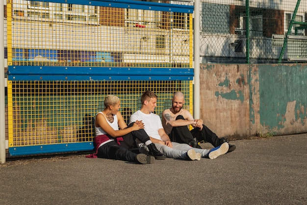 Full shot friends sitting together