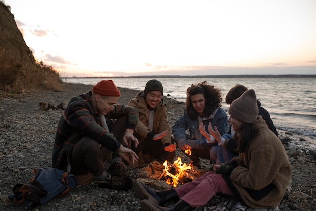 Full shot friends sitting together