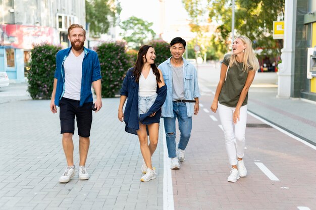 Full shot friends walking together