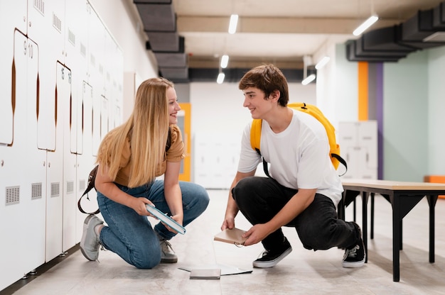 Full shot girl and boy looking at each other