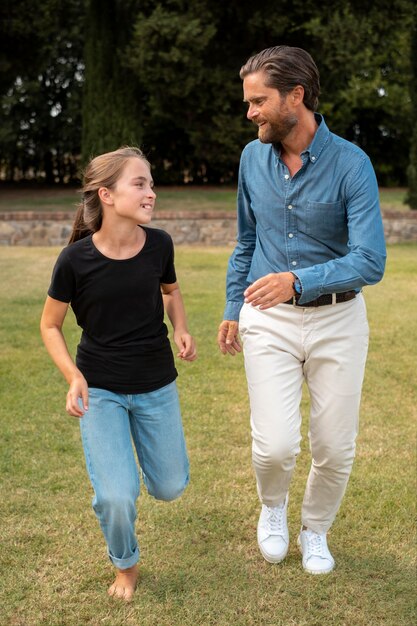 Full shot girl and man running together