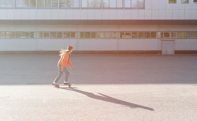 Full shot girl skating