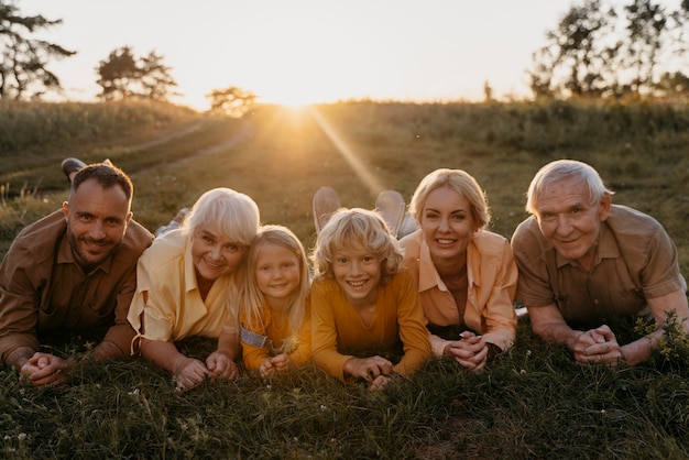 Full shot happy family on grass