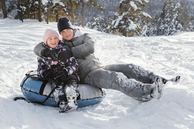 Full shot happy family members outdoors