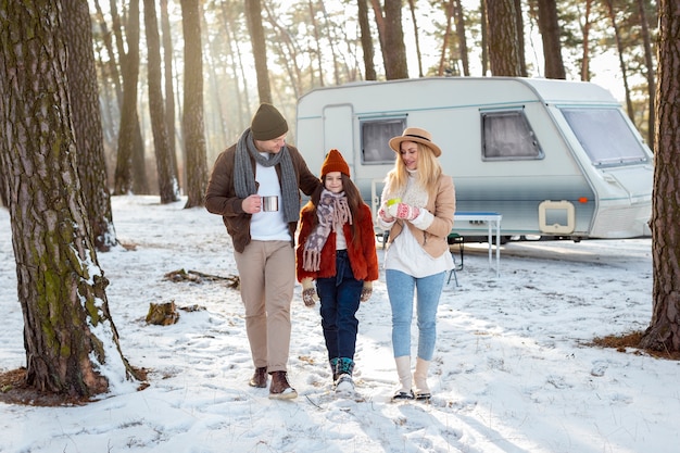 Free photo full shot happy family in nature