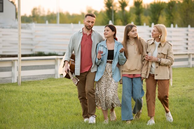 Full shot happy family outdoors