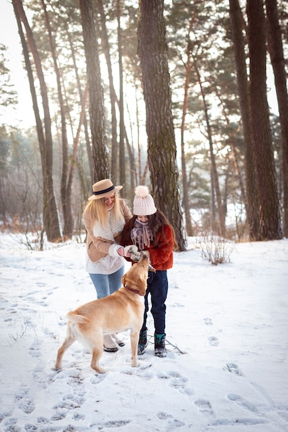 Full shot happy family with dog