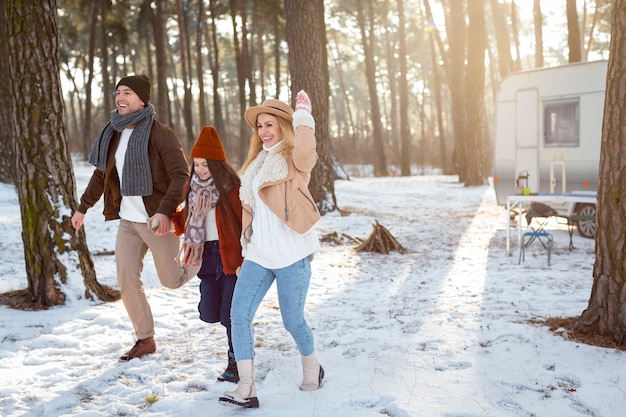 Free Photo full shot happy family with kid outdoors