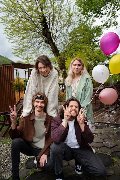 Free photo full shot happy friends posing in nature