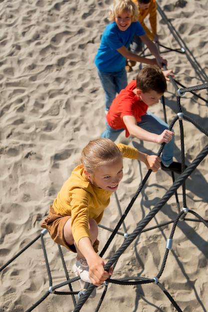 Full shot happy kids outdoors