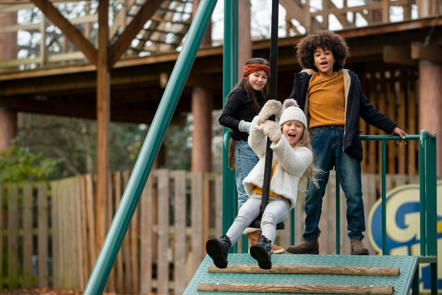 Full shot happy kids playing together