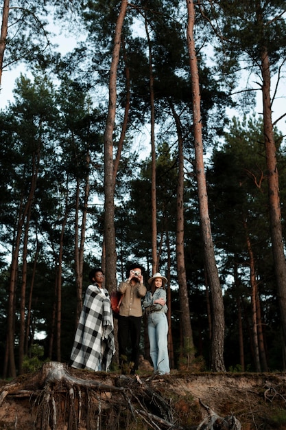 Full shot happy people in forest