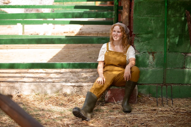 Full shot happy woman at farm