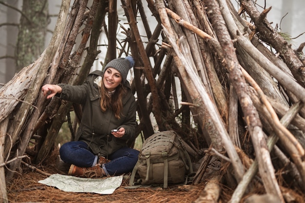 Full shot happy woman in shelter