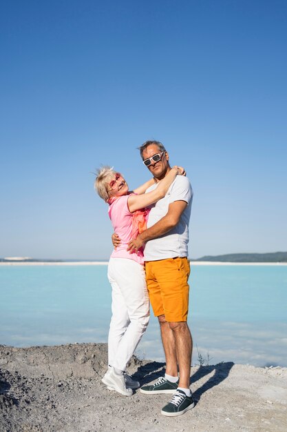 Full shot hugging couple posing