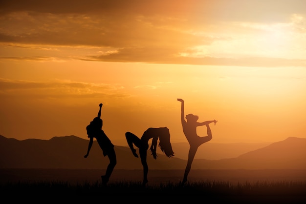 Full shot human silhouettes dancing together