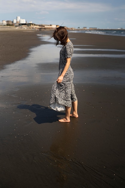 Free Photo full shot japanese woman at beach