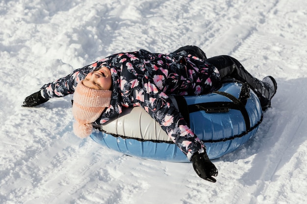 Full shot kid having fun outdoors