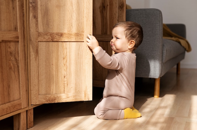 Full shot kid opening closet