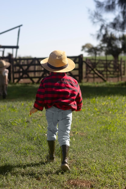 Full shot kid wearing hat