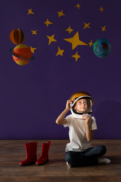 Free photo full shot kid wearing helmet