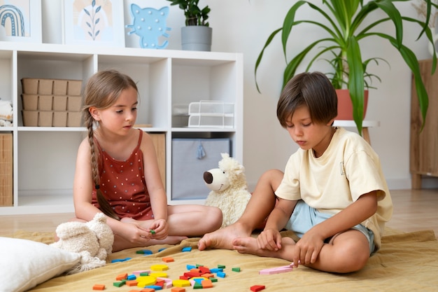 Full shot kids making puzzle together