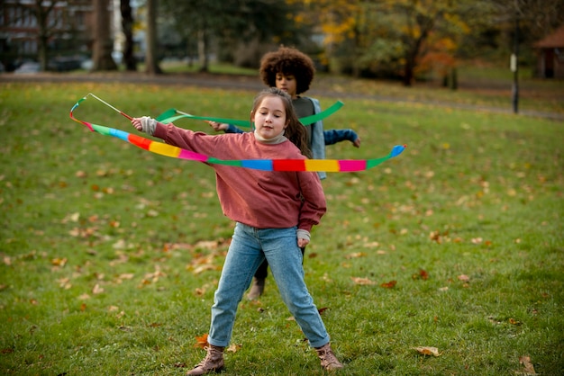 Full shot kids playing in nature