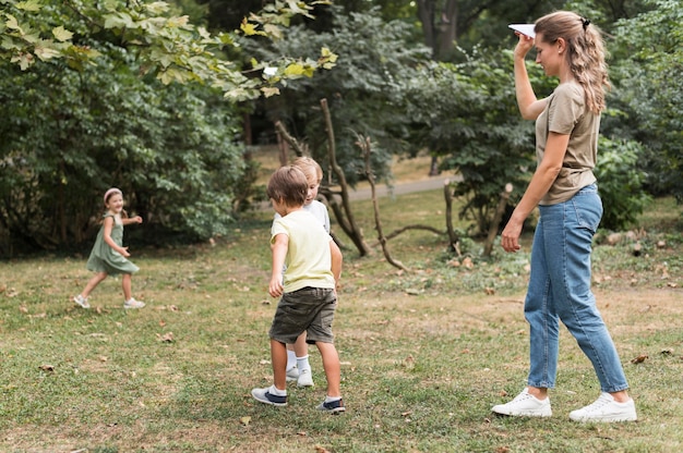 Free photo full shot kids playing outdoors