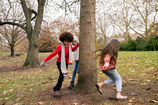 Free photo full shot kids playing outdoors