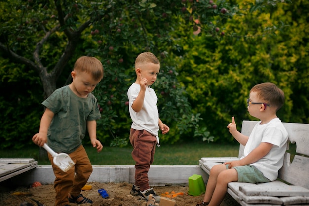 Free photo full shot kids playing outdoors