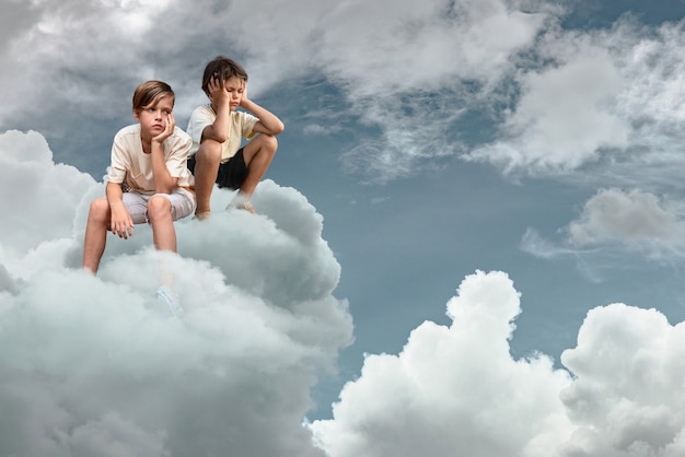 Free photo full shot kids sitting on cloud