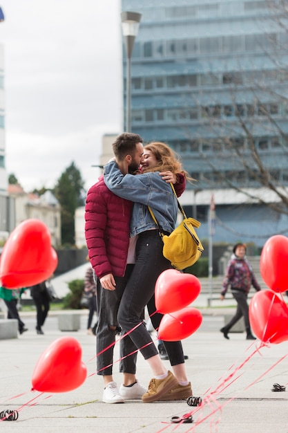 Free Photo full shot of lovely couple kissing