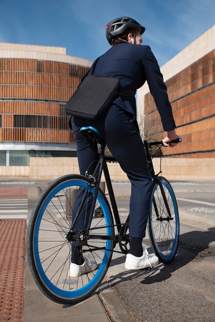 Full shot man on bicycle going to job