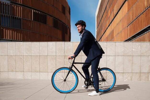 Full shot man on bicycle going to work