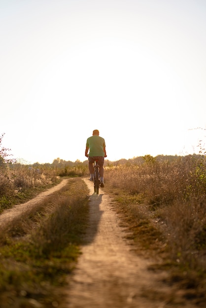 Full shot of a man on a bicycle