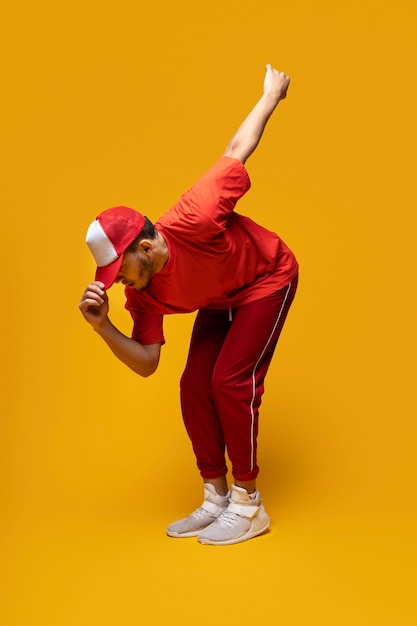 Free photo full shot man dancing with yellow background