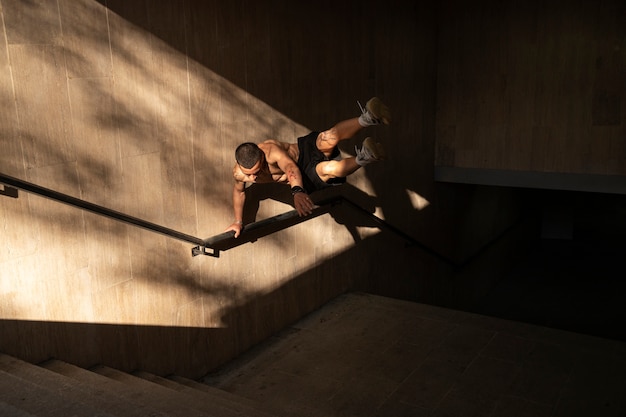 Free photo full shot man doing parkour training