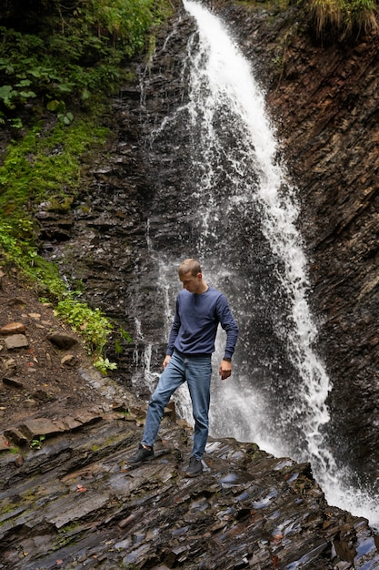 Free photo full shot man enjoying time in nature