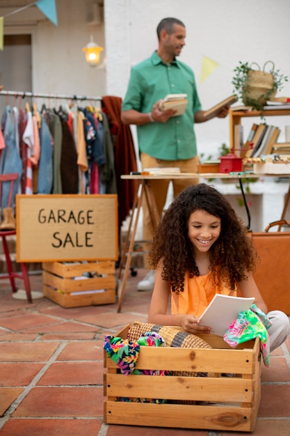 Free Photo full shot man and girl at garage sale