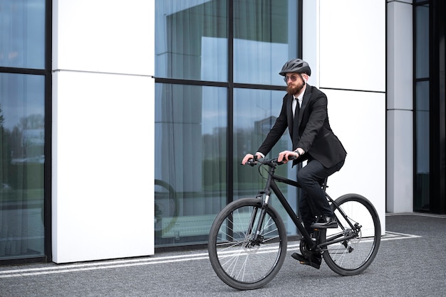 Full shot man going to work on bicycle