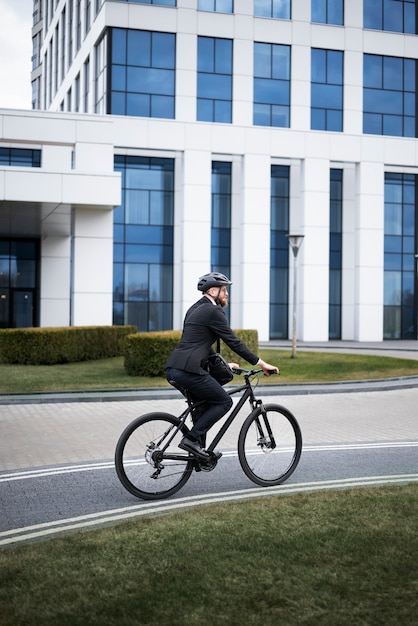 Full shot man going to work on bicycle