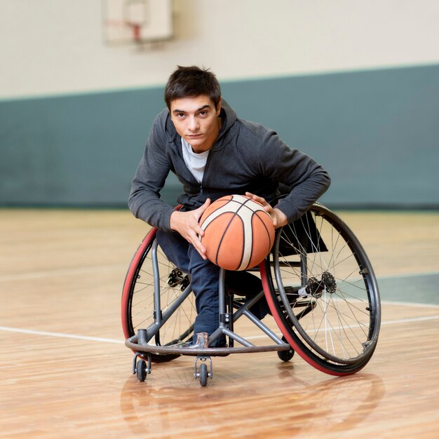 Full shot man holding basketball