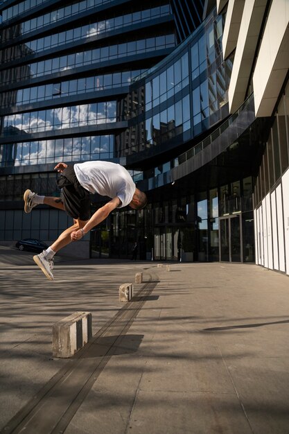 Full shot man jumping outdoors